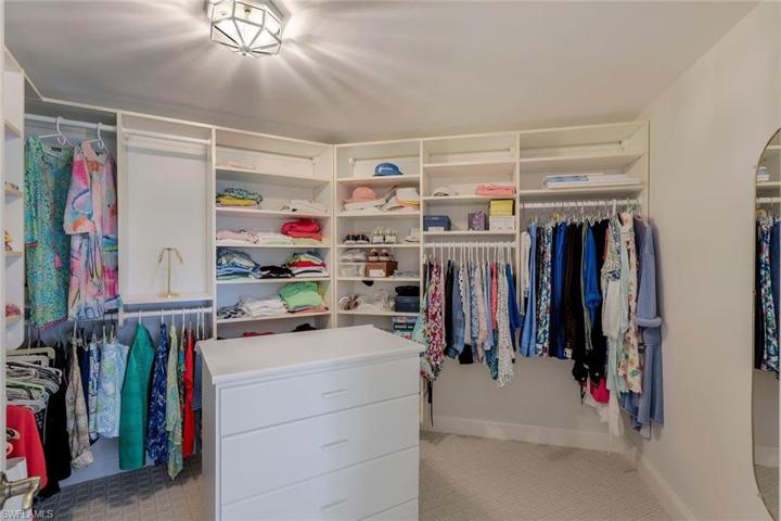 A dream come true - custom cabinets, shelves and multi level hanging racks!