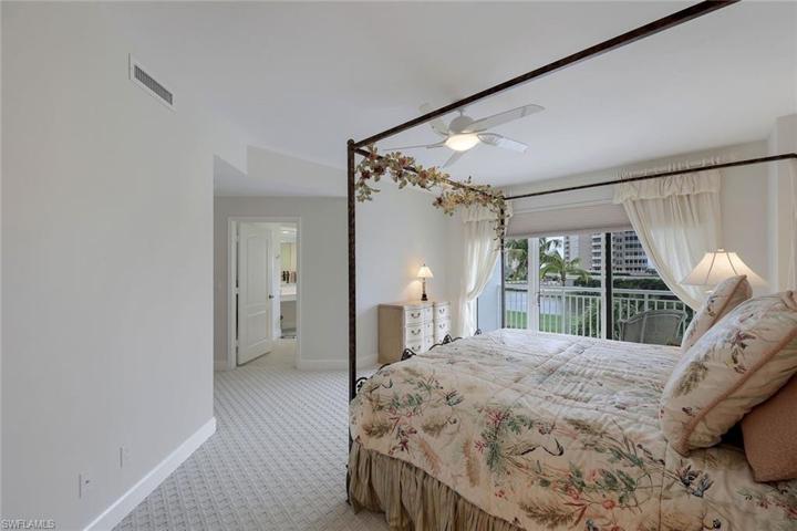 Primary bedroom with open air balcony.