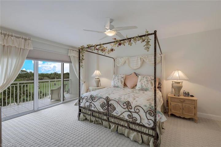 OVERSIZED primary bedroom with new carpet.