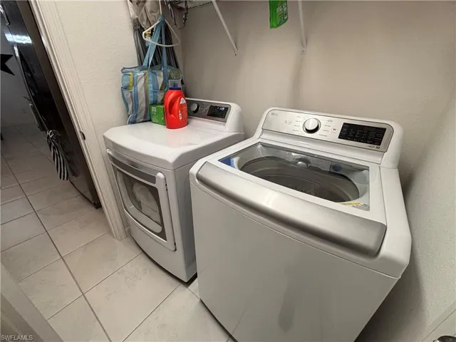 Laundry area featuring washer and dryer and laundry area