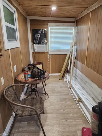 Flex space featuring cooling unit and wood ceiling