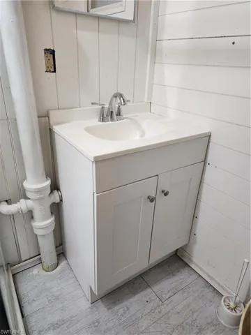 Bathroom featuring vanity and hardwood / wood-style floors
