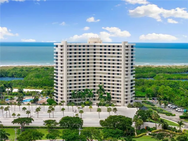 View of property with a water view