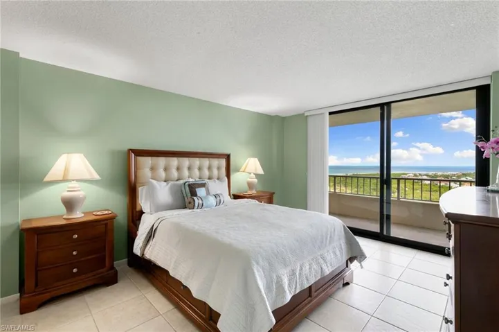 Primary bedroom with balcony access