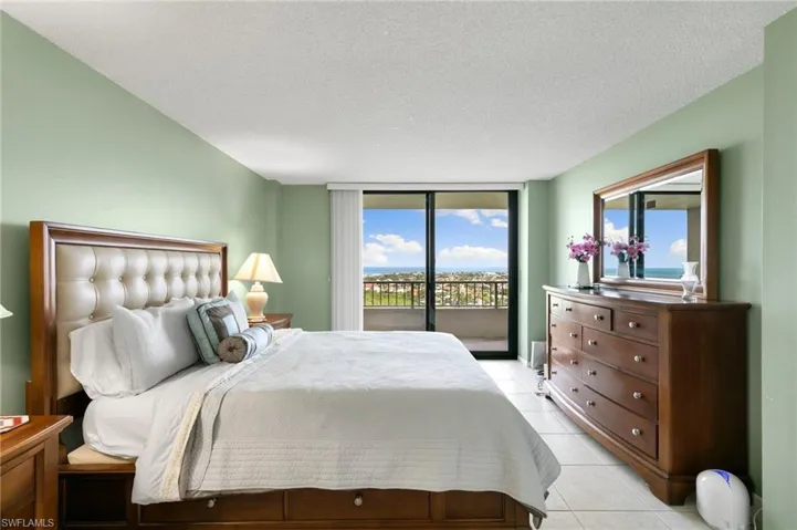 Primary bedroom with balcony access