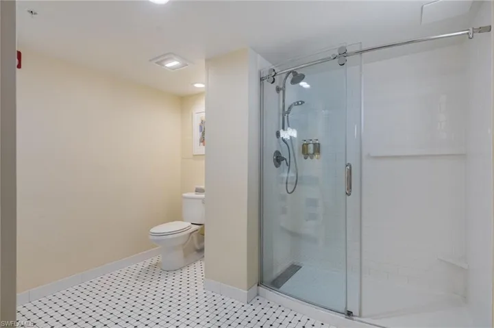 Spa-like bathroom with clear glass shower.
