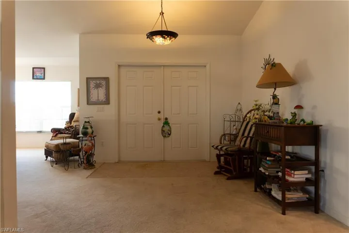 View of carpeted foyer