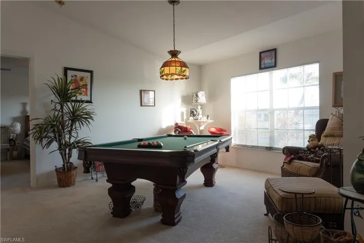 Playroom featuring pool table and light colored carpet