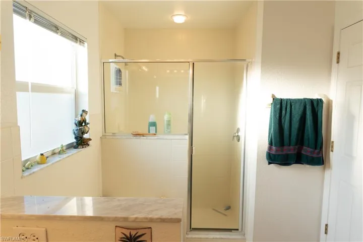 Bathroom with a shower with door