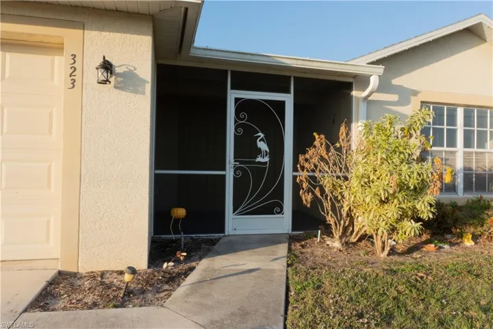 Property entrance with a garage