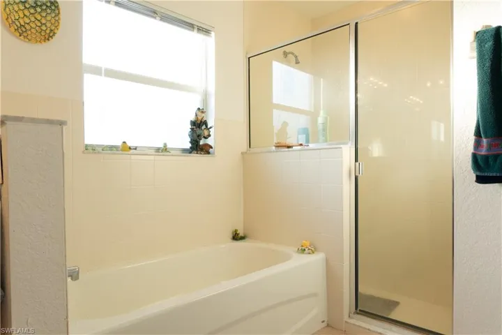 Bathroom featuring plus walk in shower