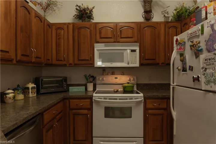 Kitchen featuring white appliances