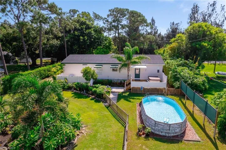 View of swimming pool featuring a yard