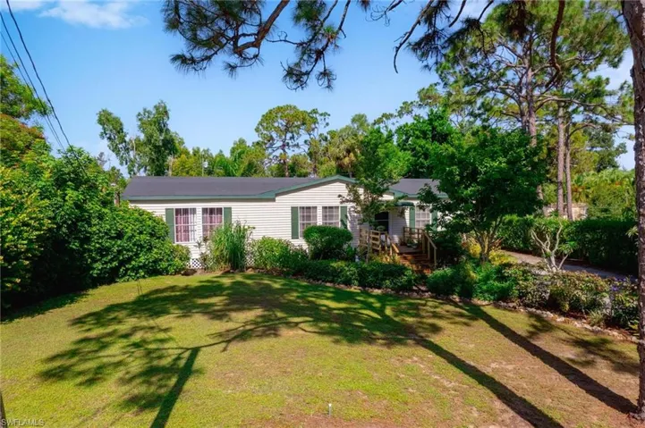 View of front of house with a front yard
