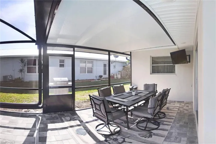 Sunroom / solarium featuring outdoor dining space