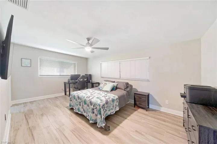 Bedroom featuring light wood finished floors and ceiling fan