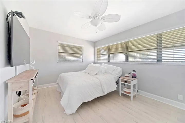 Bedroom featuring light wood-type flooring and ceiling fan