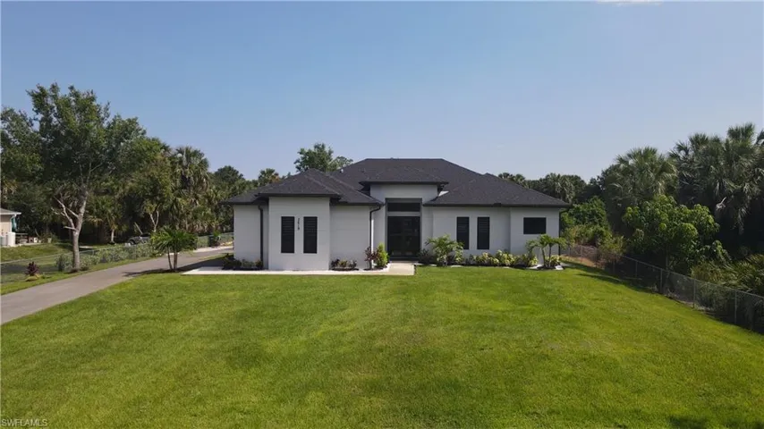 Prairie-style home featuring a front yard