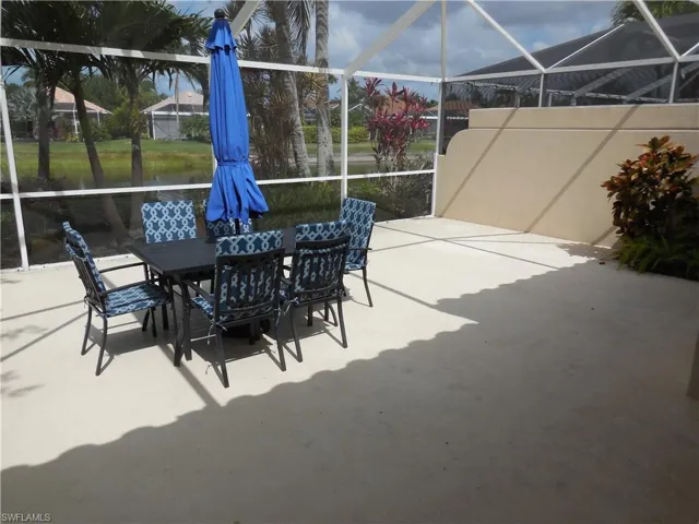 View of patio / terrace featuring a lanai and outdoor dining space