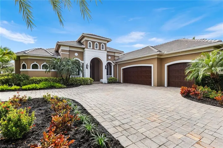 Mediterranean / spanish house featuring a garage