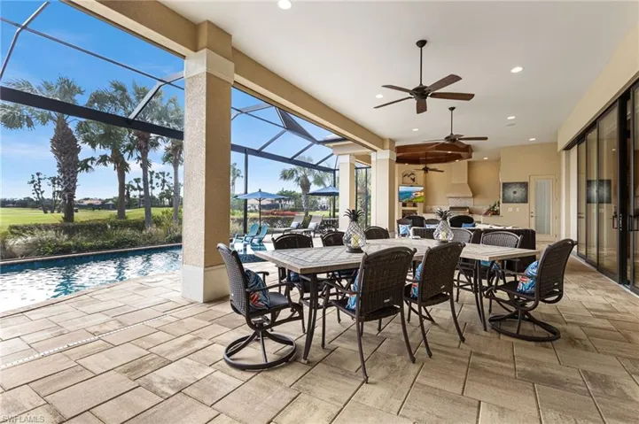 View of patio / terrace with a lanai and ceiling fan