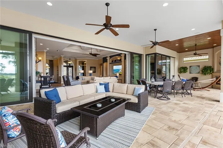 View of patio featuring an outdoor hangout area and ceiling fan