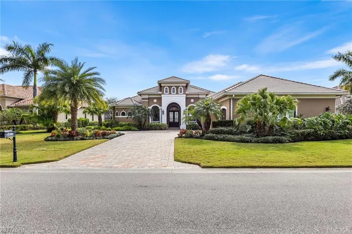 Mediterranean / spanish-style house featuring a front yard