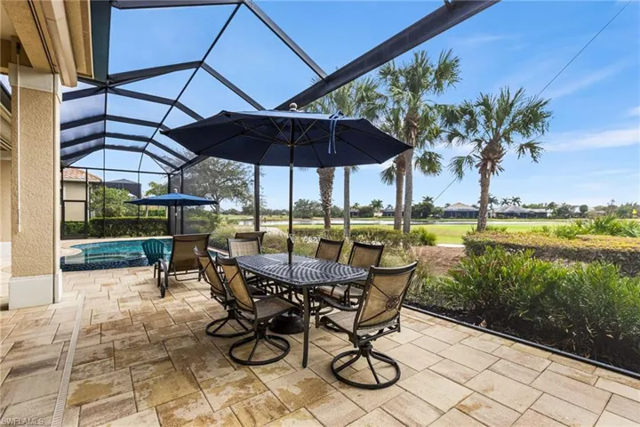 View of patio featuring glass enclosure