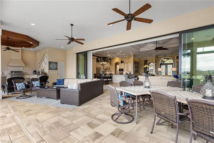 View of patio / terrace with an outdoor kitchen, outdoor lounge area, and ceiling fan
