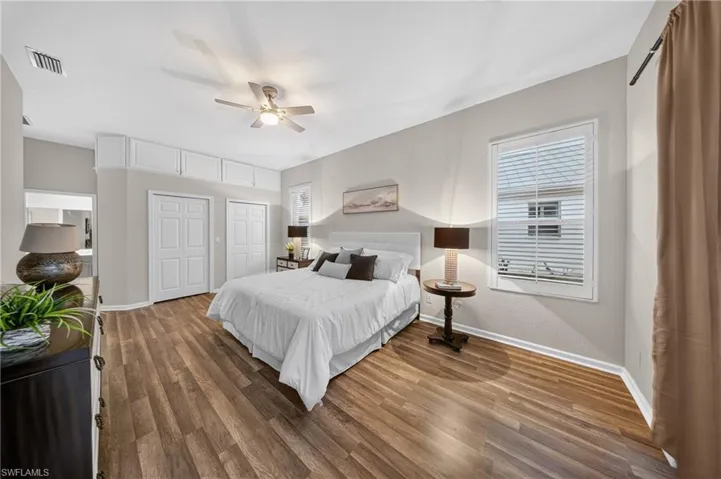 Primary bedroom offers dual closets and a private en-suite entrance.