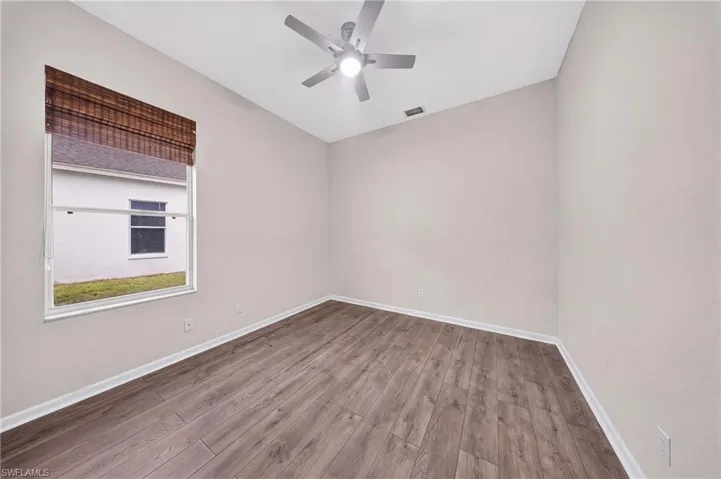 Freshly painted bedroom with all-new laminate flooring.