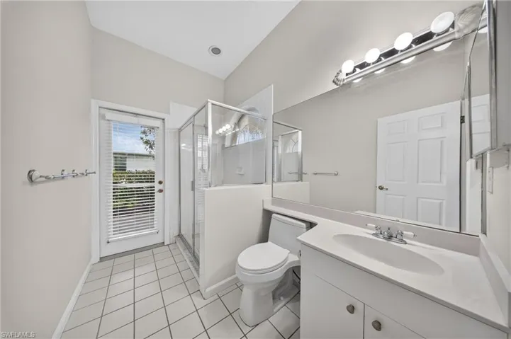 Third full bath with walk-in shower and convenient lanai access.