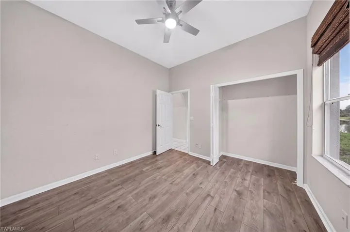 Generous secondary bedroom with new flooring and ample closet.