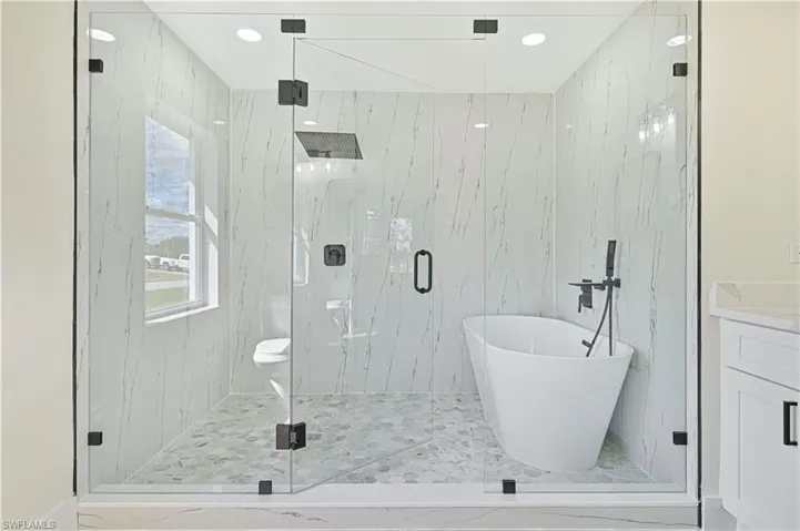 huge shower with stand along tub