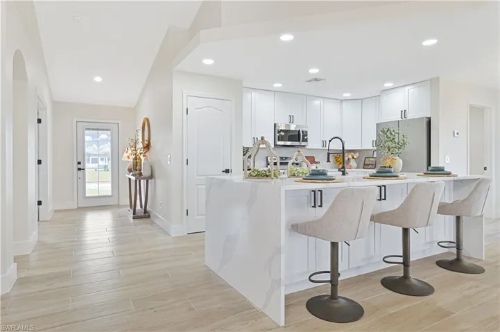 brand new kitchen with calacatta quartz and water island