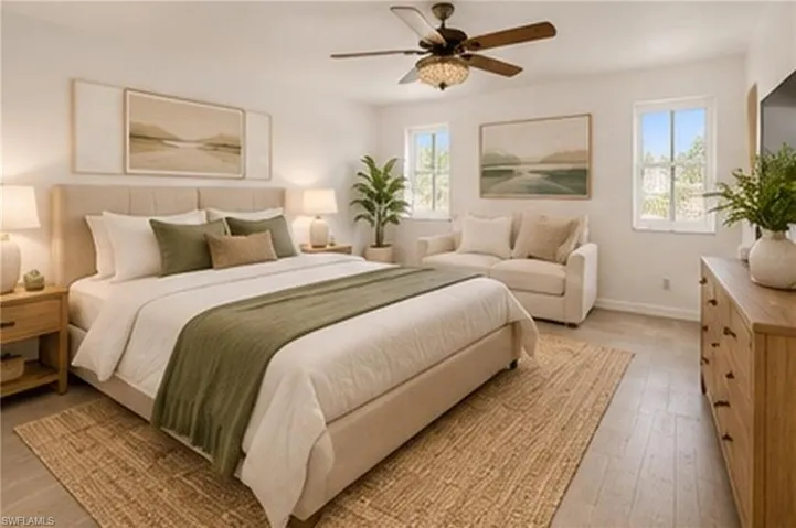 Wood-finish flooring, dual windows, and a ceiling fan with integrated lighting