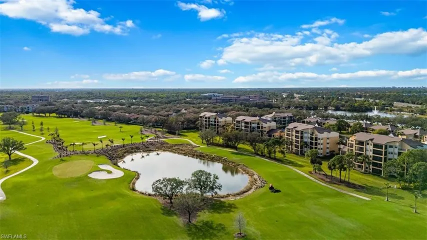 Bird's eye view of a local golf course and a large body of water