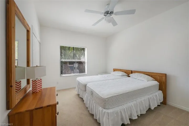 Bedroom featuring carpet and ceiling fan