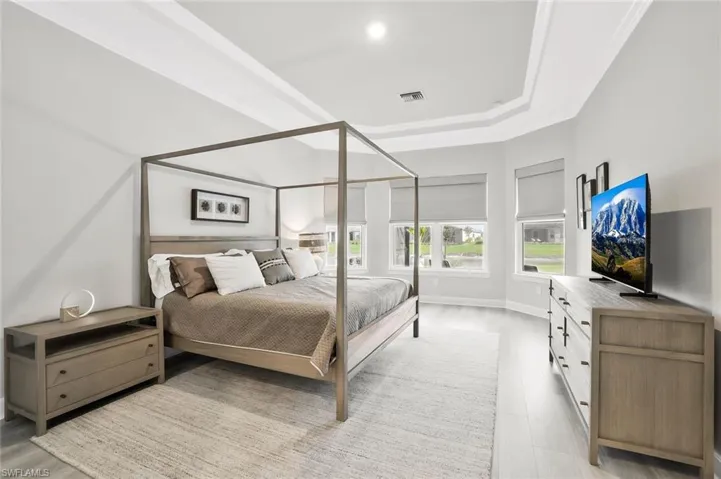 Bedroom featuring a tray ceiling