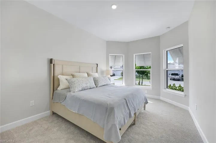 Carpeted bedroom with baseboards