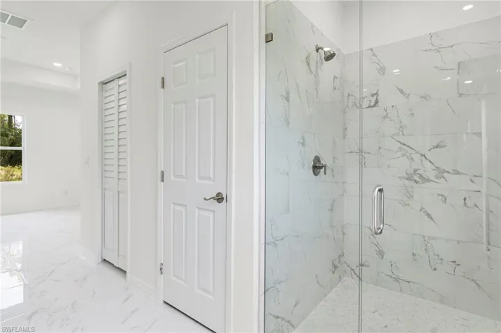 Bathroom with tile floors and walk in shower