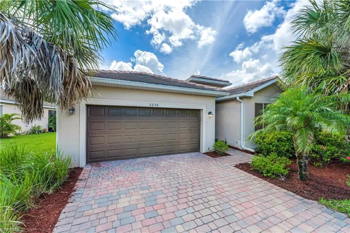 View of front of property with a garage
