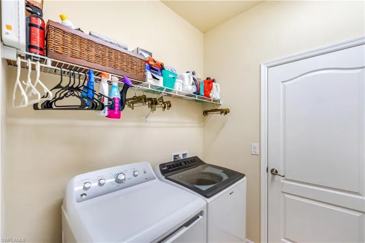 Washroom featuring washer and clothes dryer
