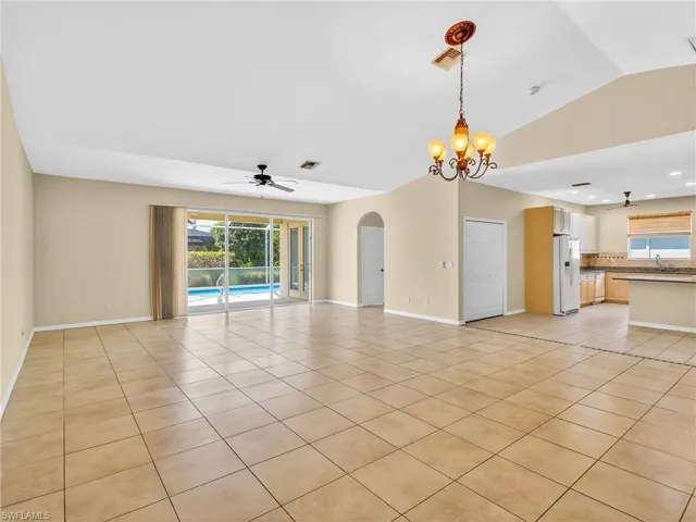 Living/dining with vaulted ceilings & tile floors