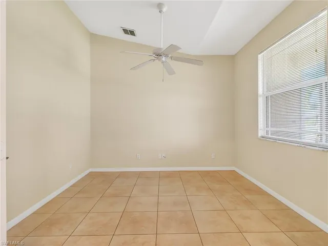 Room featuring vaulted ceilings, ceiling fan, and ceramic tile flooring