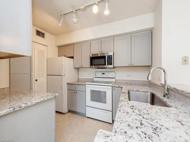 Kitchen Features New Cabinets and Granite Countertops