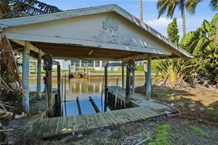 Dock with a water view and boat lift