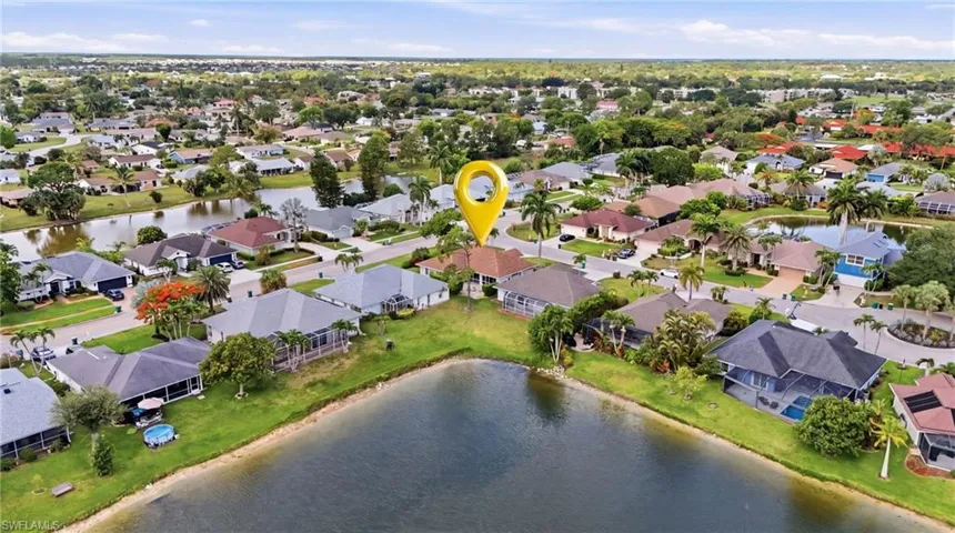 Large corner lot with long lake views.