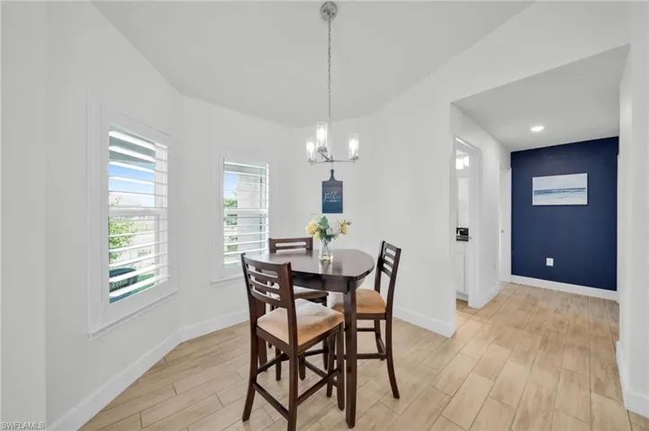 Breakfast nook with lots of sunshine and water view.