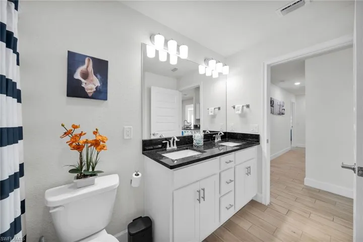 Guest, Full bath with double vanity and full tub/shower.